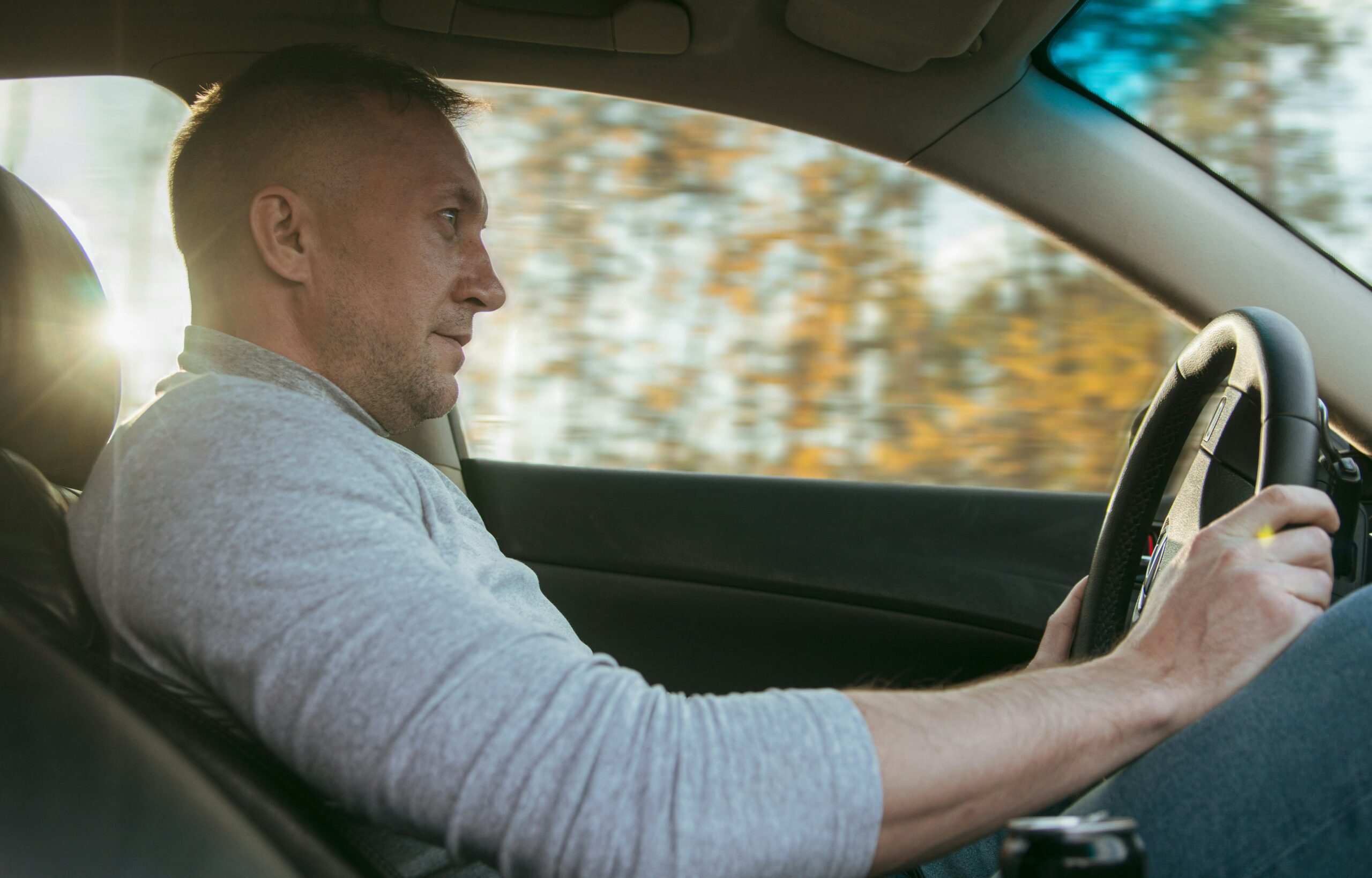 Middle-Aged man driving a car
