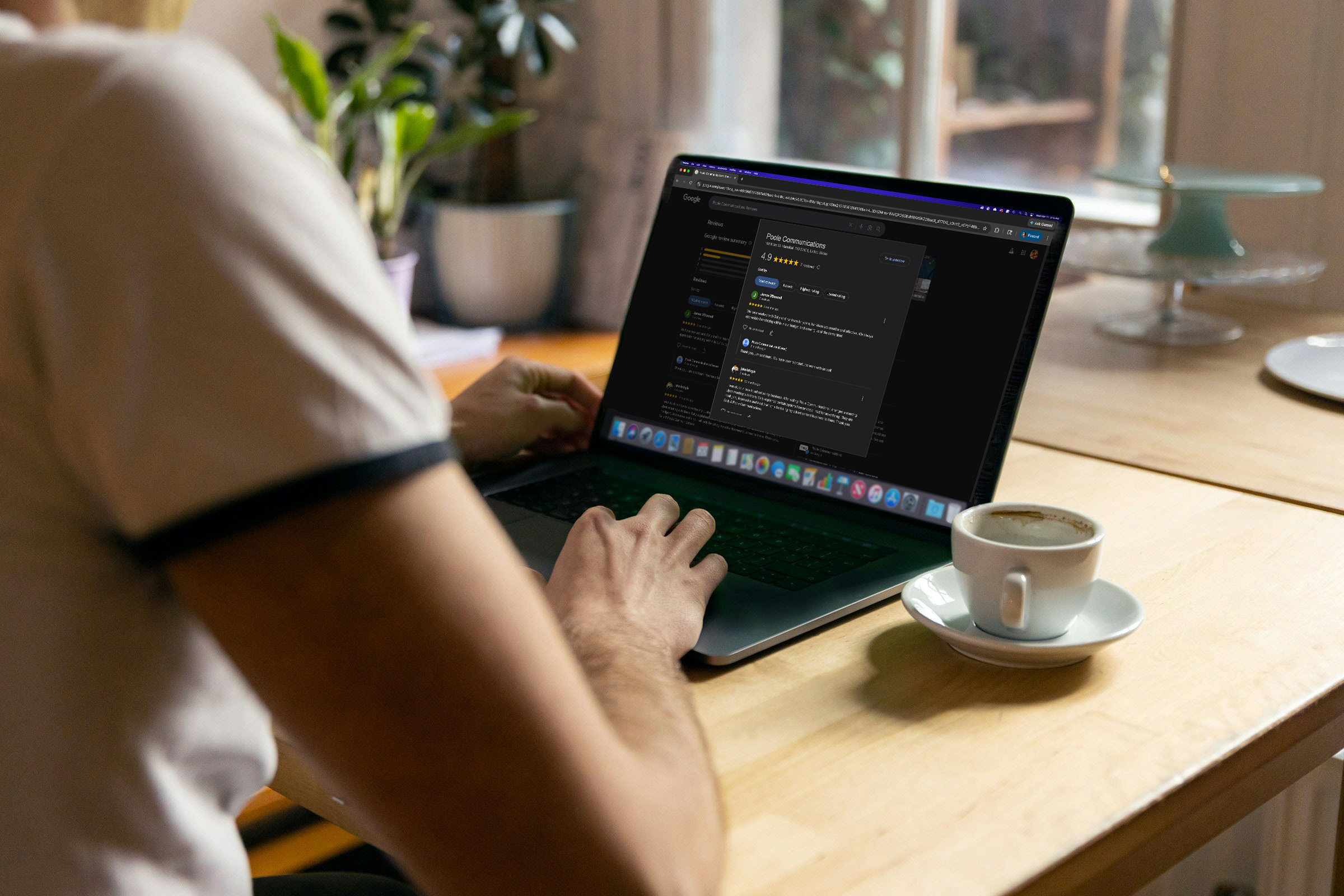 A woman reading reviews on a laptop.