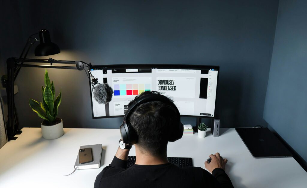 Male looking looking at colors and text on a computer.